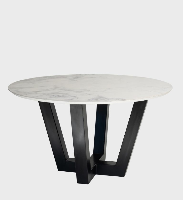 The Bellissima Table is a striking fusion of elegance and modern geometry. Its round marble‑effect top, with subtle gray veining, rests on a sculptural black base composed of angular intersecting legs.